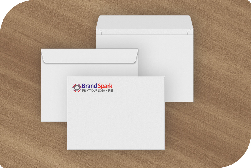 Some Booklet Envelopes on a desk showing different sides and logo printing